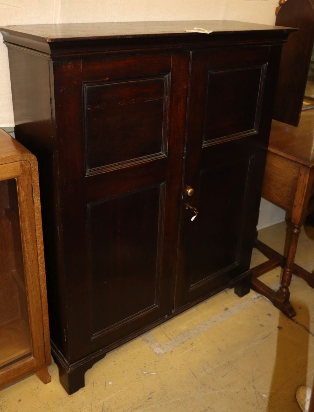 A 19th century two-door oak cupboard, W.101cm, D.34cm, H.124cm